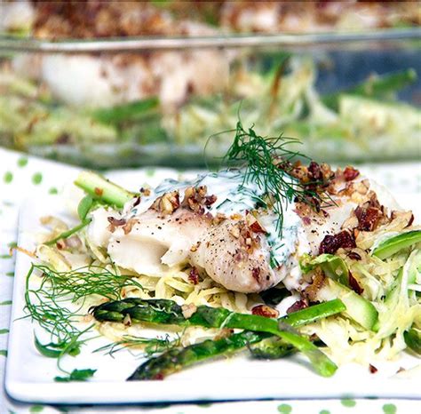Fresh Haddock Fillets Are Baked An A Bed Of Shredded Vegetables And