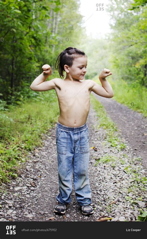 Young Boy Flexing His Muscles Stock Photo Offset