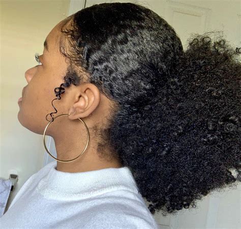 Slick Low Afro Puff On Natural Hair Natural Hair Puff Natural Curls