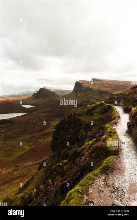 Hiking Path At Quiraing On A Moody Cloudy Autumn Day With Orange