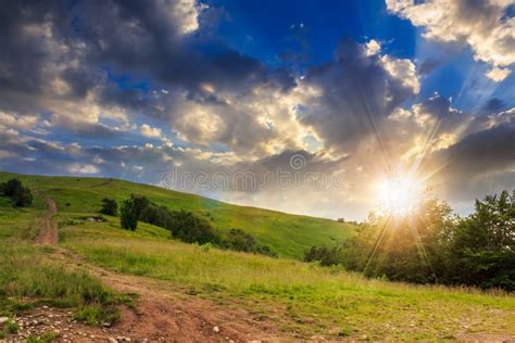 Path On Hillside Meadow In Mountain At Sunset Stock Photo Image Of
