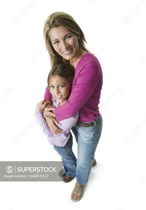 High Angle View Of A Mother Hugging Her Daughter Superstock