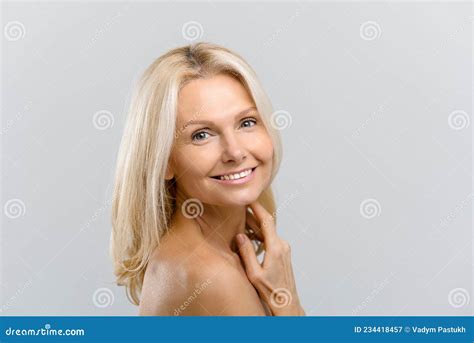 Stunning Middle Aged Woman With Naked Shoulders Looks At Camera Stock