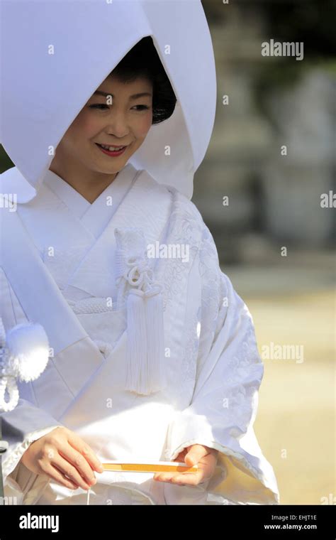 A Bride In Traditional Japanese Bridal Kimono And Headdress During A