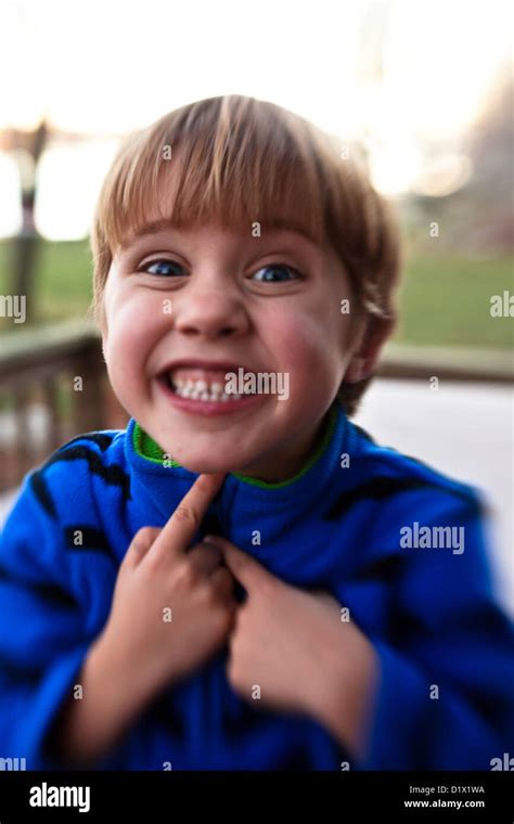 Little Boy Making Faces And Being Silly Outside Of His House Stock