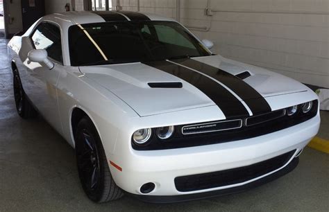 Gloss Black Dual Racing Stripes Installed On A White Dodge Challenger