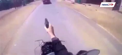 Crazy Ass Cop Shoots Wildly From Motorcycle During Urban Police Chase