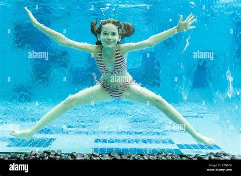 Girl Swimming Underwater In Swimming Pool Photo Stock Alamy