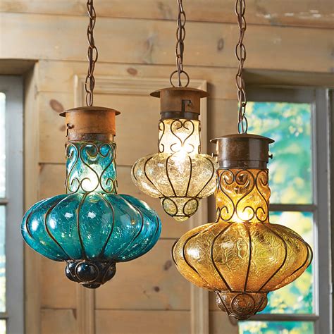 It has white etched glass shade for even distribution of light. Southwestern Flower Glass Pendant Lights