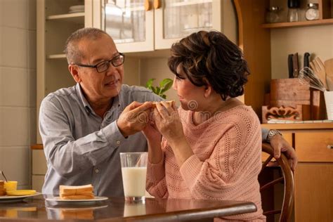 Senior Husband Taking Care Of His Wife In The House Stock Image Image