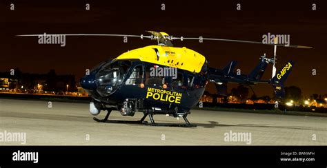Metropolitan Police Helicopter On Stand At Night Raf Northolt Stock