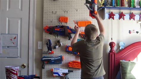 Tired of nerf toys cluttering up the backyard? how to set up a nerf gun rack - YouTube