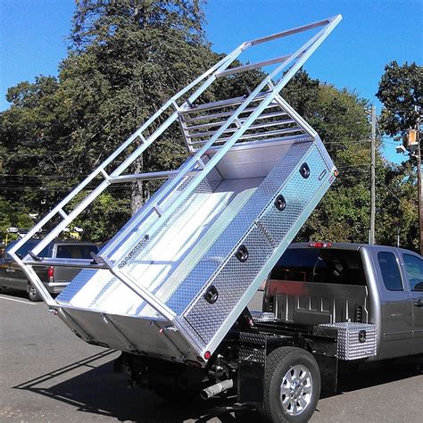 Factory direct manufacturer of truck racks, lumber racks, headache racks, truck tool boxes, truck cabguards, rv tow bodies, aluminum flatbeds, cargo slides, and other accessories for pickup trucks, vans, medium trucks, semi trucks and trailers. This Custom Truck Bed comes with a rear gate, stow-away ...