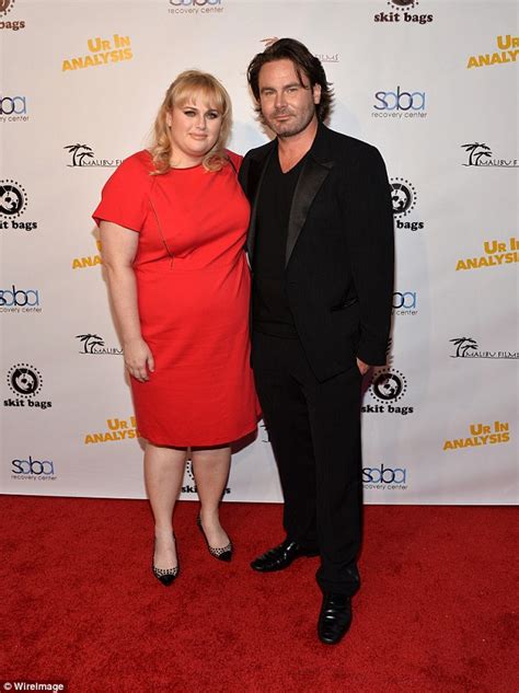 The cabin in the woods. Rebel Wilson and boyfriend Mickey Gooch walk their 1st red ...