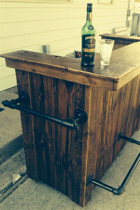 A compelling material mix makes this bar cart a handsome focal point for home entertaining. Reclaimed Wood Bar - DIY Homer