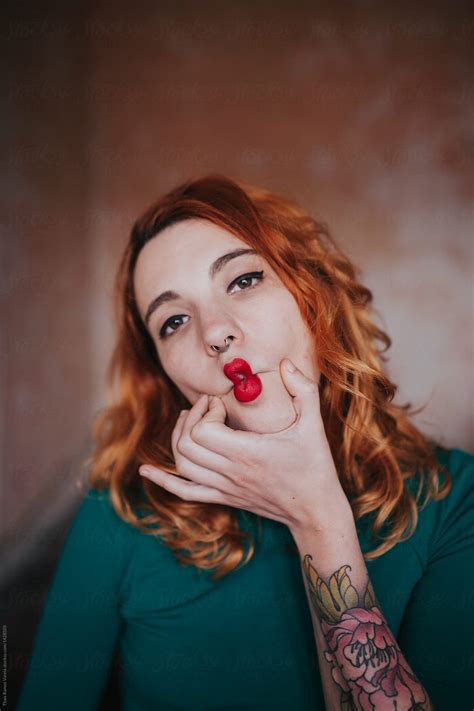 Portrait Of A Ginger Woman Pinching Her Face By Thais Varela