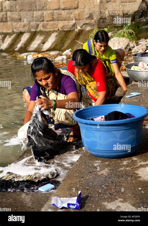 Indian Women Washing Clothing On Steps Of Ramkund Bathing Tank Nasik Maharashtra India Stock