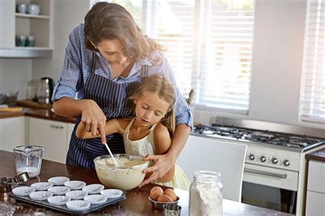 Creating Lasting Memories A Mother And Her Daughter Baking In The Kitchen Stock Image Image