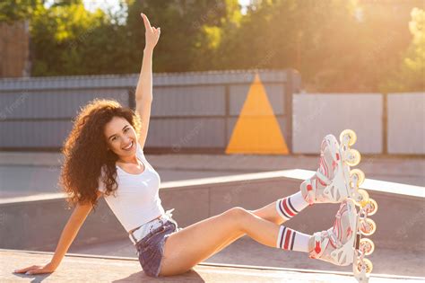 Free Photo Beautiful Girl Posing In Rollerblades Outdoors