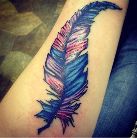 This tattoo is basically a celtic cross with a small bird on it. Pin by Lauren Opeka on Graphic design | Feather tattoo ...