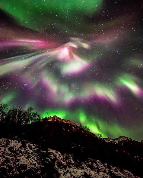 The Night Sky Comes Alive As The Northern Lights Twist And Swirl Over