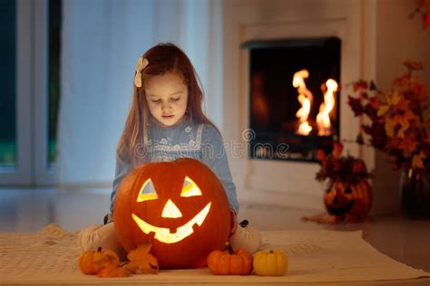 Kids Carving Halloween Pumpkin Stock Photo Image Of Halloween