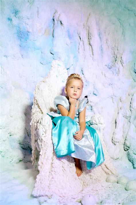 Little Girl In Princess Dress On A Background Of A Winter Fairy Stock