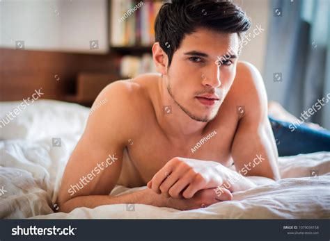 shirtless sexy male model lying alone stok fotoğrafı 1079034158 shutterstock