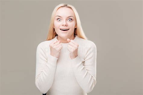 Surprised Young Woman Shouting Over Grey Background Looking At Camera