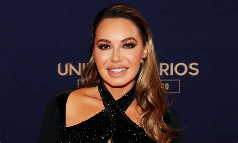 Chiquis Rivera Shows Off Her Curves In A Tight White Dress With A Deep Neckline On The Red