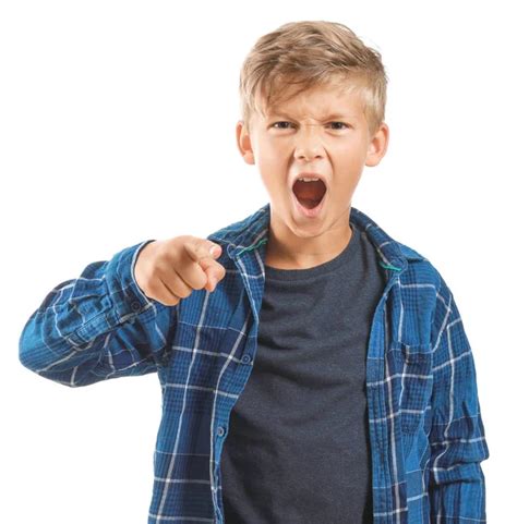 Portrait Of Angry Little Boy On Grey Background Stock Photo By