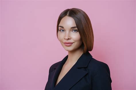 Isolated Shot Of Pretty Dark Haired Woman With Healthy Glowing Skin