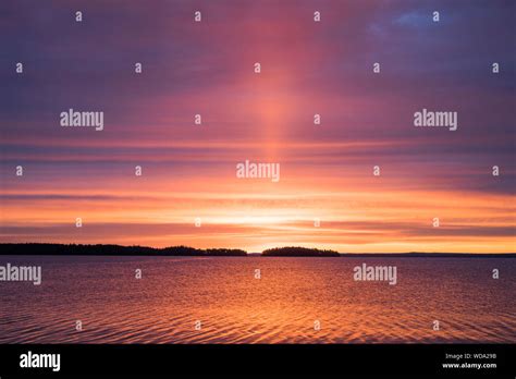 Sun Setting Over The Sea Stock Photo Alamy