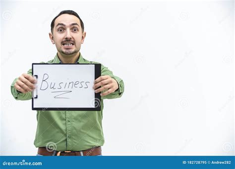 Brunette Bearded Man Holding Paper Holder With Word Business Writen On It Looking With Comical