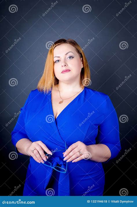 Beautiful Chubby Girl In Blue Elegant Dress On A Black Background