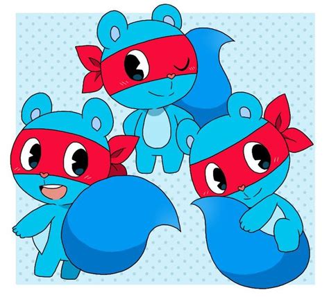 Three Blue And Red Stuffed Animals With Masks On Their Heads Sitting