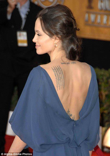 Angelina Jolie Turns Her Designer Dress Back To Front To Show Off
