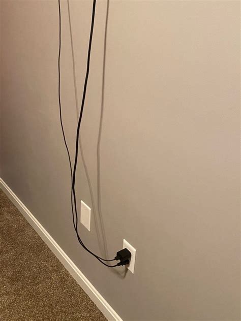 How To Move An Electrical Outlet Behind A Wall Mounted Tv Home Edits