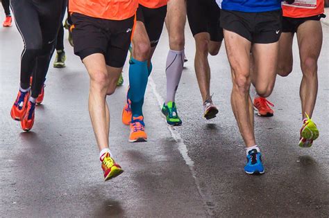 Muscular Legs Of Runners In A Marathon Race