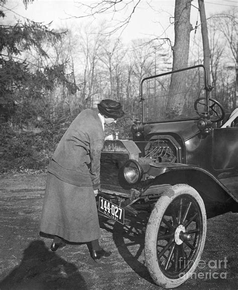 Lady Driver Cranking Her Car 1921 By Bettmann