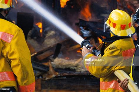 Firemen Putting Out Fire High Res Stock Photo Getty Images