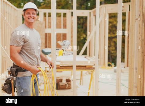 Caucasian Construction Worker Smiling On Site Stock Photo Alamy