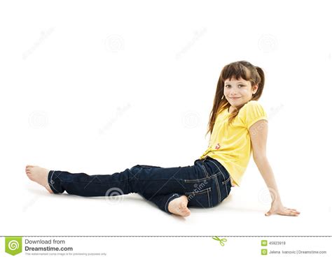 Pretty Little Girl Lying On The Floor In Jeans Stock Photo
