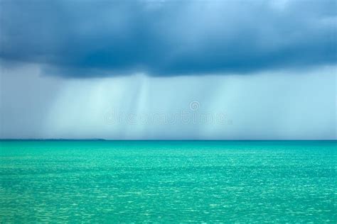 Storm Rain Clouds Over The Turquoise Sea Stock Photo Image Of