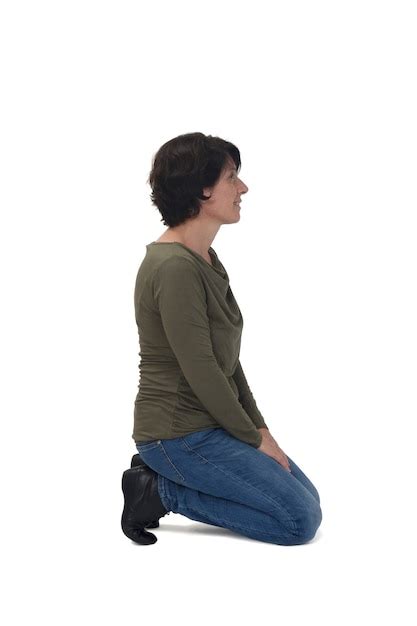 Premium Photo Side View Of A Woman Kneeling On White Background