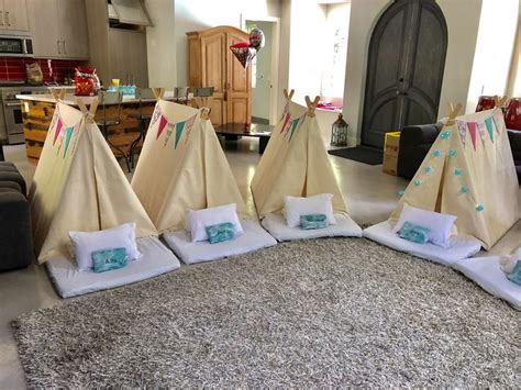 A Group Of Teepees Sitting On Top Of A Rug