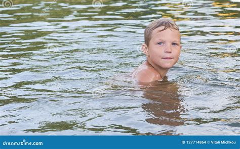 Portrait Of Happy Fun Little Caucasian Boy Swimming In The Sea Or Lake