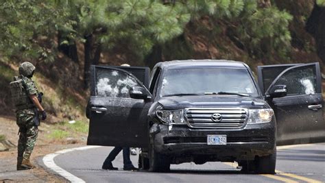 mexico charges 14 cops for ambush of cia agents suv