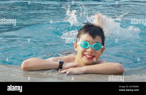 Young Boy Happy In Swimming Pool Stock Video Footage Alamy