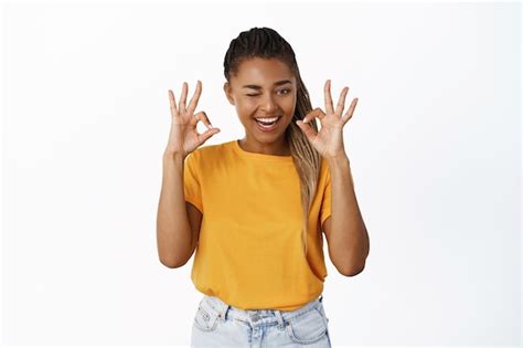 Premium Photo Portrait Of Beautiful African American Girl Shows Okay Gesture With Satisfied